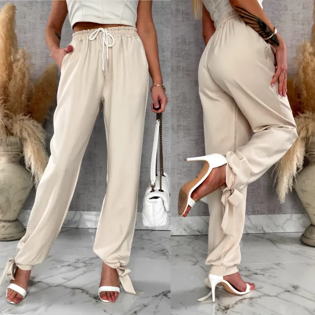 Wiosenne beżowe spodnie z gumką w pasie i wiązanymi nogawkami ONE SIZE - R672A