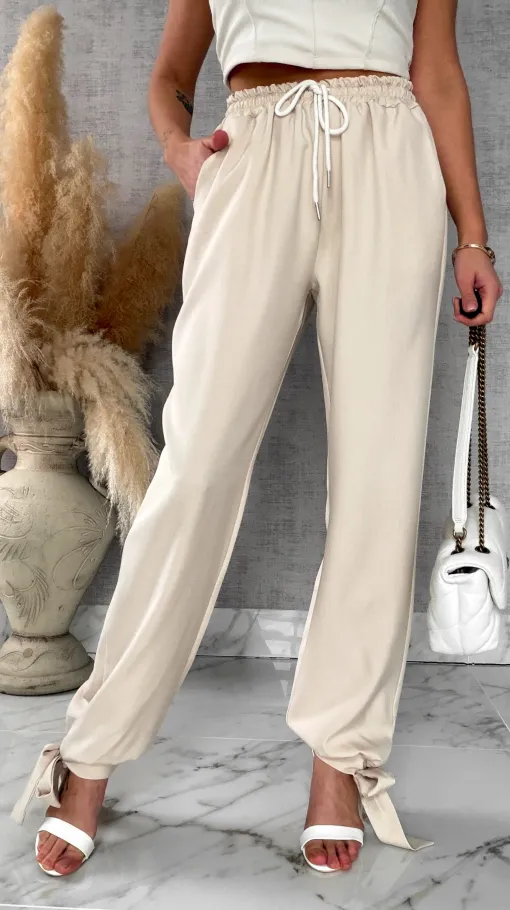 Wiosenne beżowe spodnie z gumką w pasie i wiązanymi nogawkami ONE SIZE - R672A