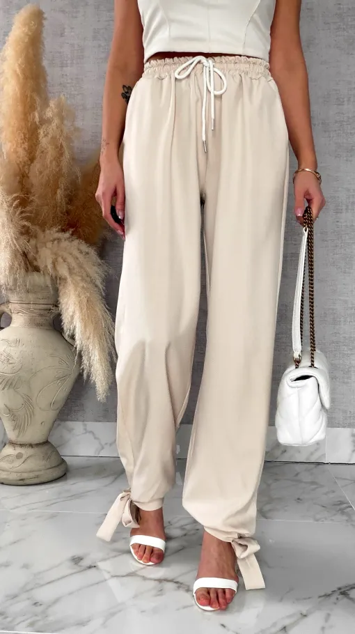 Wiosenne beżowe spodnie z gumką w pasie i wiązanymi nogawkami ONE SIZE - R672A