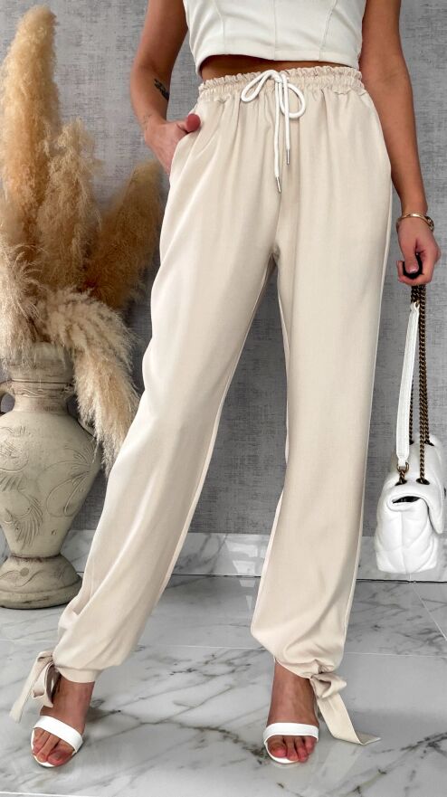 Wiosenne beżowe spodnie z gumką w pasie i wiązanymi nogawkami ONE SIZE - R672A