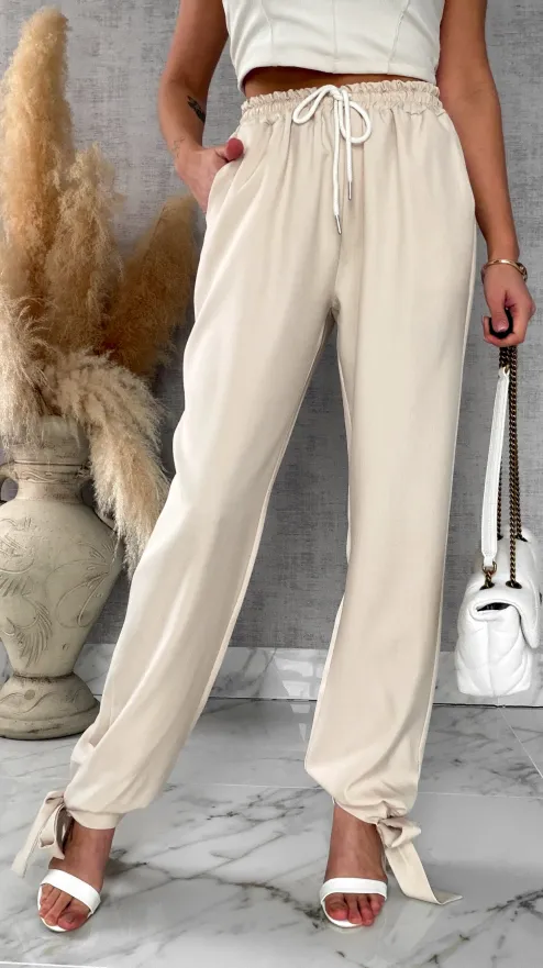 Wiosenne beżowe spodnie z gumką w pasie i wiązanymi nogawkami ONE SIZE - R672A