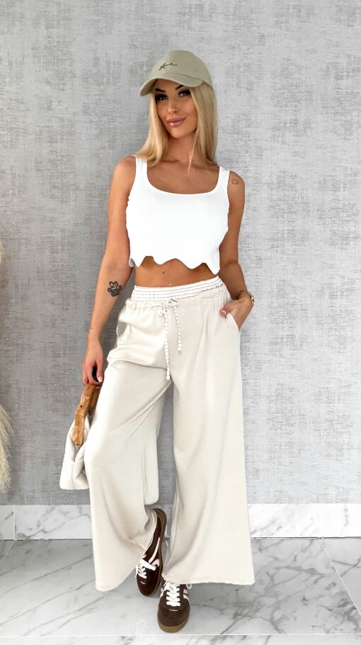 Luźne spodnie dresowe z ozdobnym pasem BEŻOWE - R564B