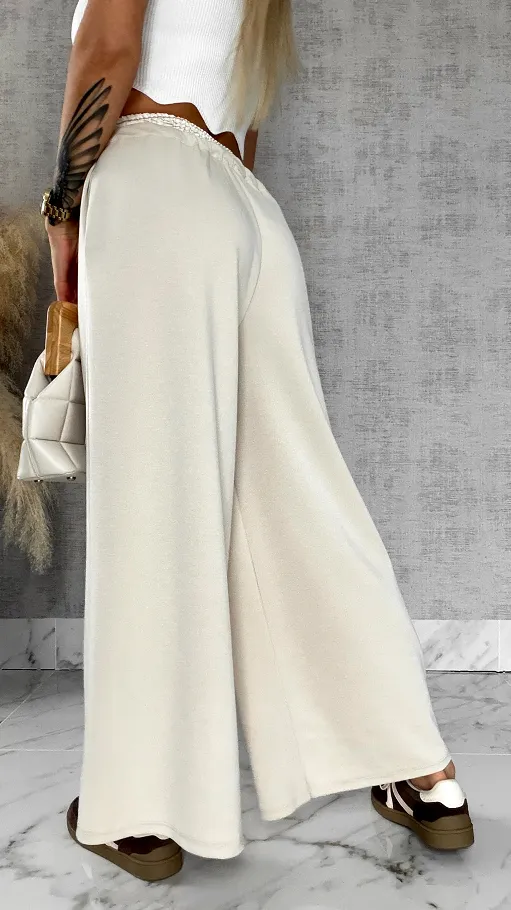 Luźne spodnie dresowe z ozdobnym pasem BEŻOWE - R564B