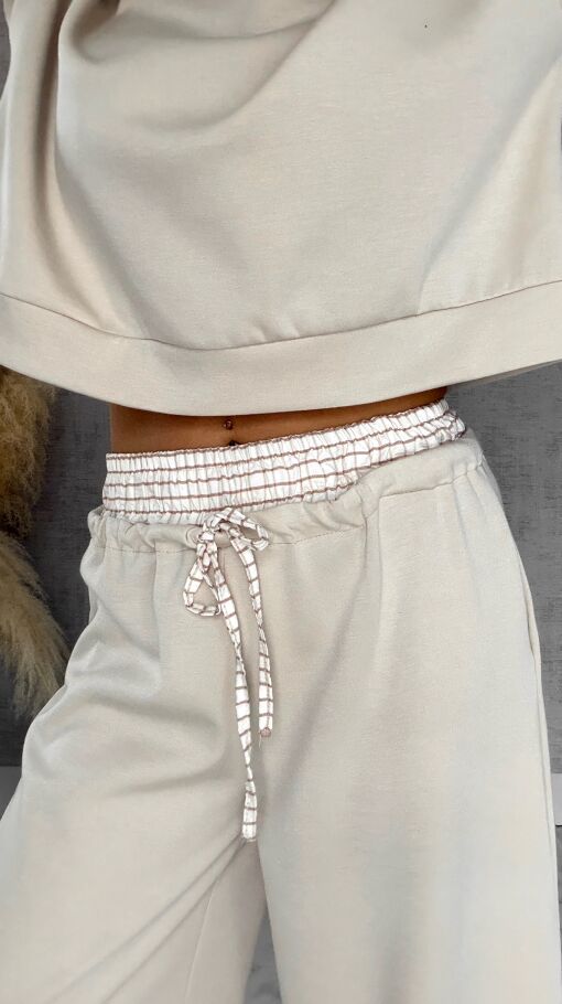 Luźne spodnie dresowe z ozdobnym pasem BEŻOWE - R564B