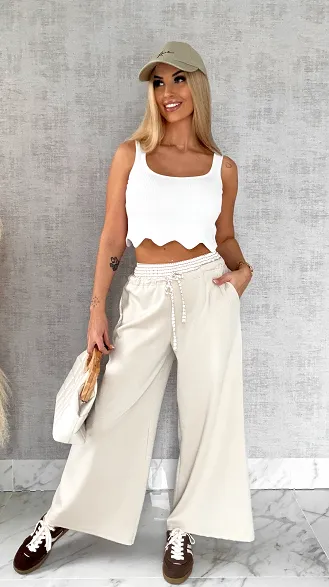 Luźne spodnie dresowe z ozdobnym pasem BEŻOWE - R564B