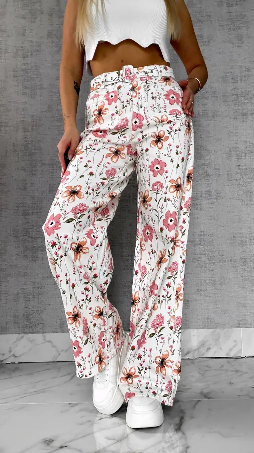 Elastyczne spodnie jeansowe WHITE JEANS w kolorowe kwiaty - R602A