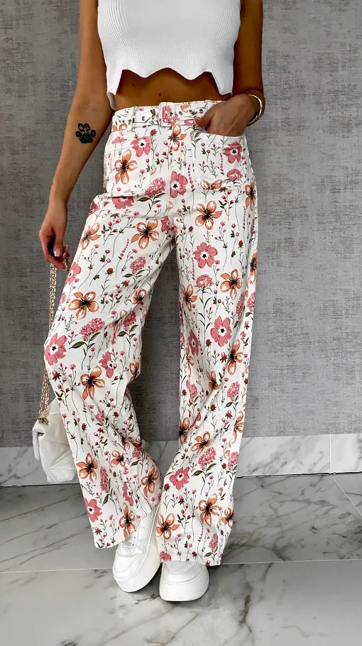 Elastyczne spodnie jeansowe WHITE JEANS w kolorowe kwiaty - R602A