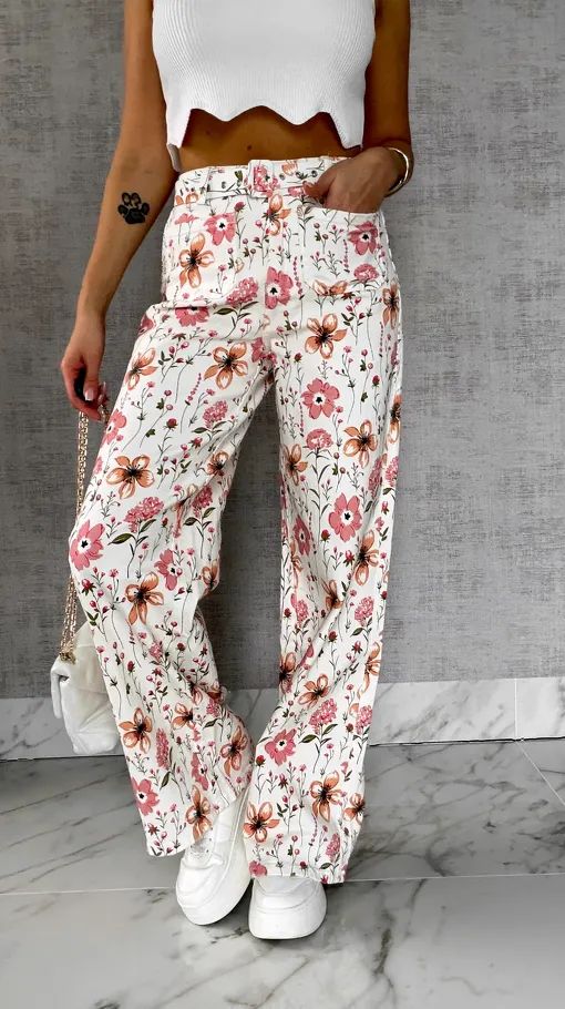 Elastyczne spodnie jeansowe WHITE JEANS w kolorowe kwiaty - R602A