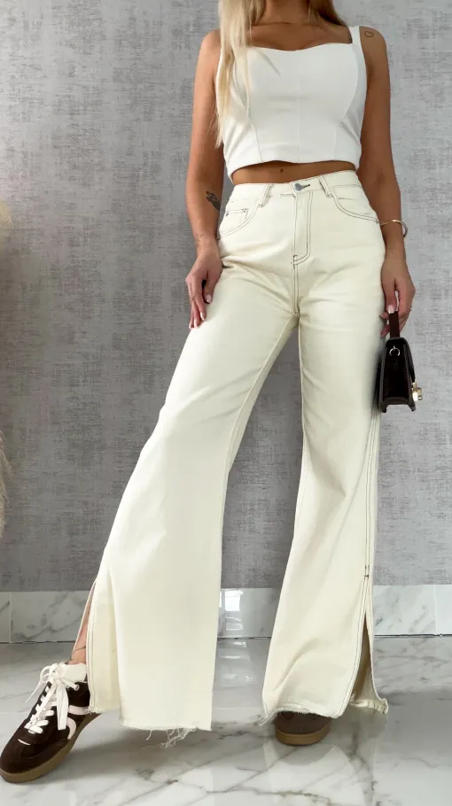 Super spodnie jeansowe z rozcięciami na nogawkach ECRU - R500