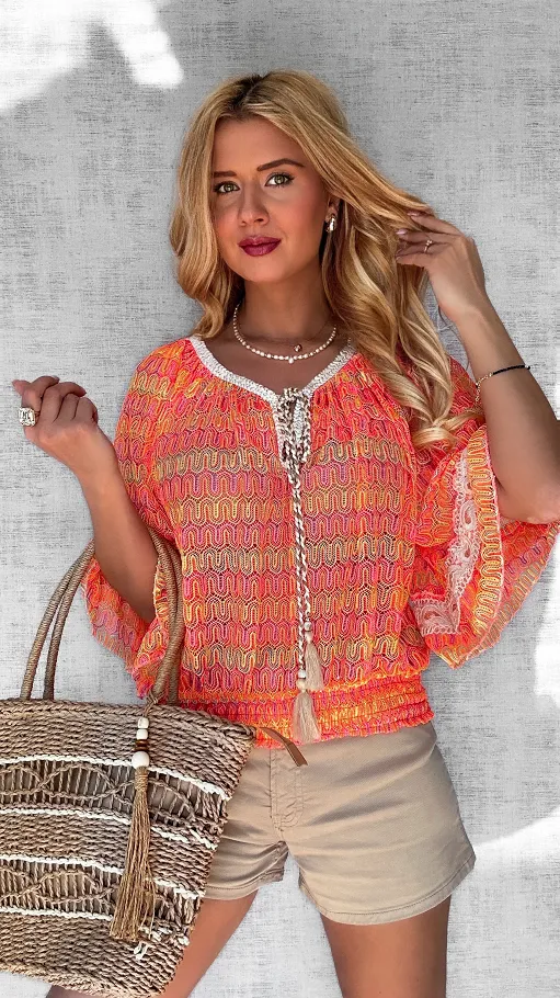 Ażurowa luźna bluzka z gumką w pasie i trokami na dekolcie NEON orange - P687A